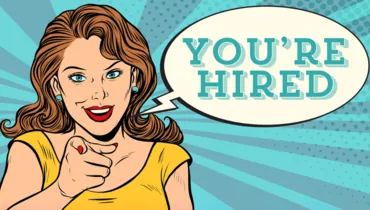 comic image of a woman pointing to you saying you're hired. 7 lucky signs you got the job article