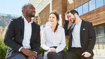 Group of professional peers talking and networking