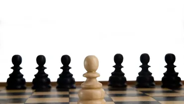 Chess game close up on white background which symbolizes  the skill of negotiation