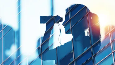 Business person looks far for new job opportunities with binoculars. double exposure
