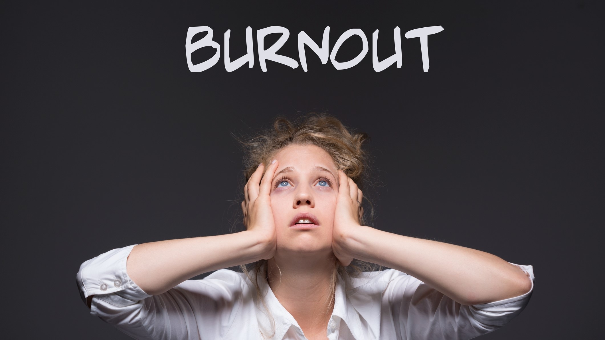 young professional woman feeling workplace burnout